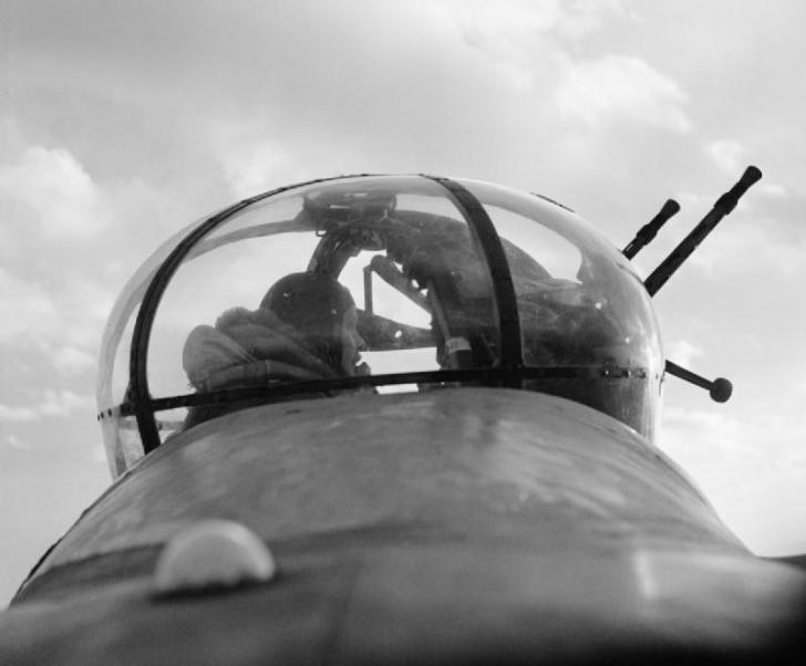 A_No._57_Squadron_Lancaster_mid-upper_gunner_in_his_turret_February_1943._CH8795