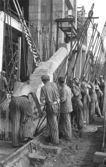 Slaves working on Valentin in 1944, positioning a prestressed concrete arch with iron bars