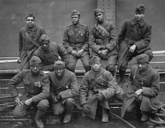 Soldiers of the 369th (15th N.Y.) who won the Croix de Guerre for gallantry in action, 1919. Left to right. Front row: Pvt. Ed Williams, Herbert Taylor, Pvt. Leon Fraitor, Pvt. Ralph Hawkins. Back Row: Sgt. H. D. Prinas, Sgt. Dan Storms, Pvt. Joe Williams, Pvt. Alfred Hanley, and Cpl. T. W. Taylor.