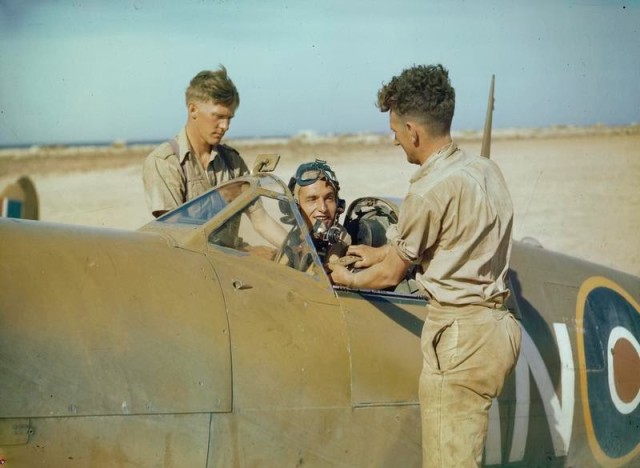 An RCAF Spitfire pilot preparing for take-off, Tunisia, 1943. © IWM (TR 872)