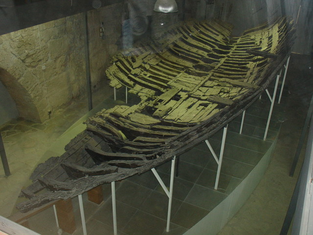 A recovered ship, possibly sunk after a run in with pirates. spear points had pierced her sides, and many standard equipment wasn't found with the ship, possibly taken by pirates.
