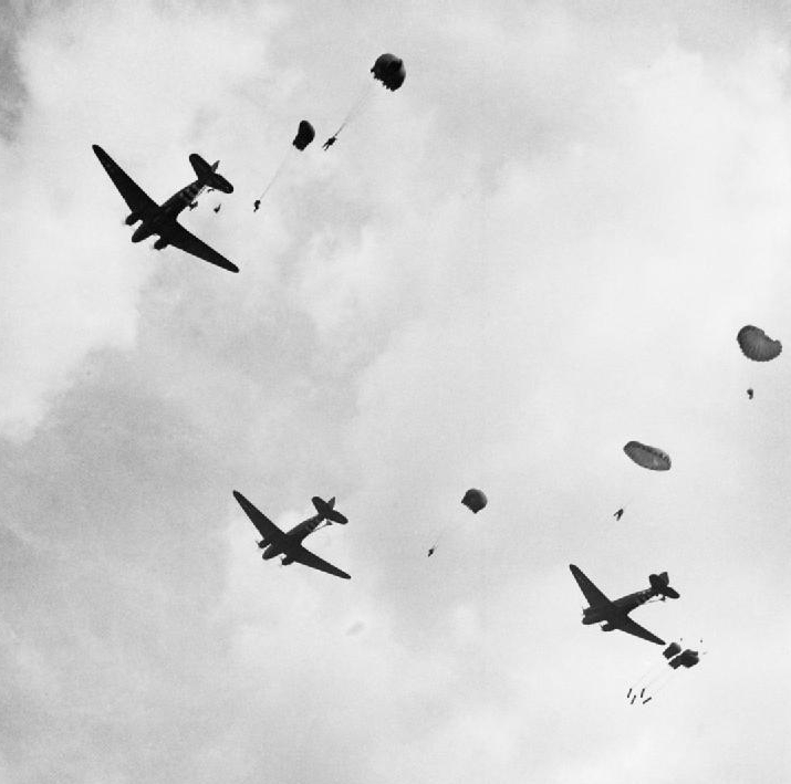 British paratroops drop from Douglas Dakota aircraft over Oosterbeek, just outside Arnhem, during Operation 'Market Garden', 17 September 1944.