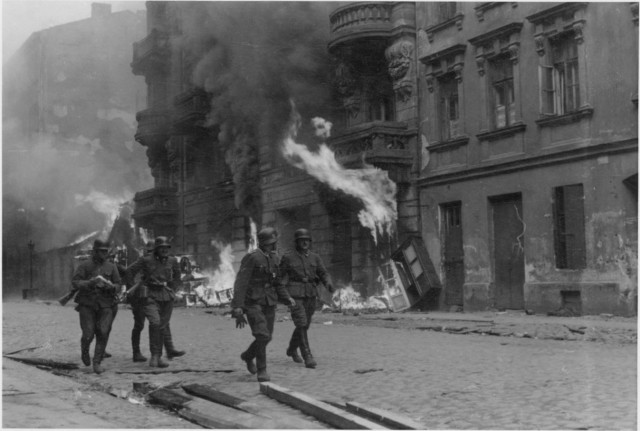 Stroop Report original caption: "A patrol." SS men on Nowolipie street.