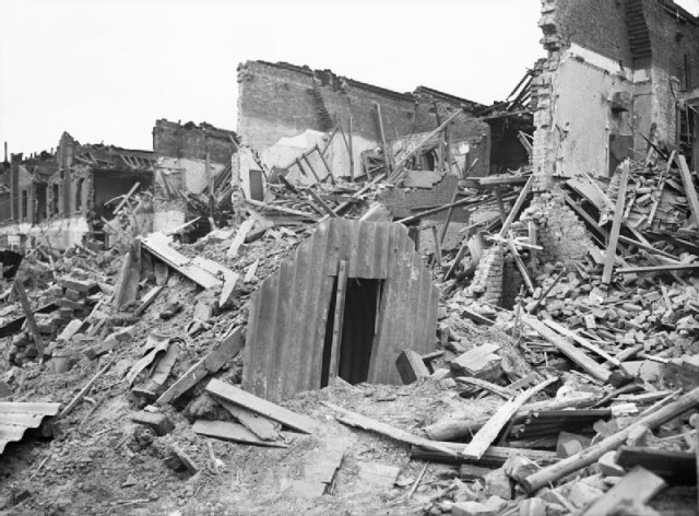 An Anderson air raid shelter in tact amongst destruction in London.