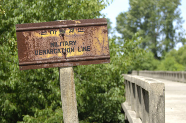 Military Demarcation Line sign. There are over 1,200 of these along the line. Wikipedia / Public Domain