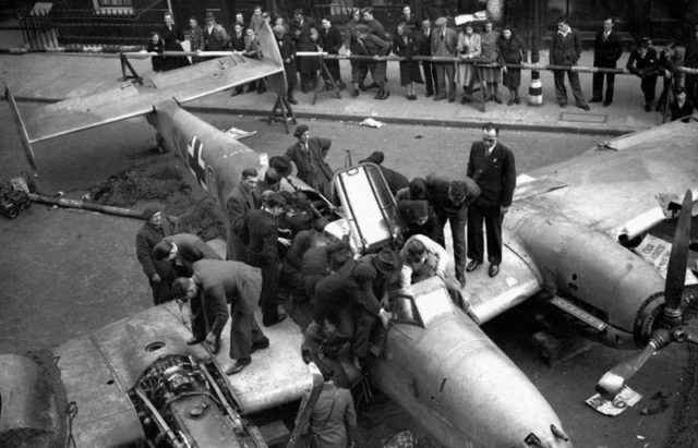 Downed Bf-110D being displayed for British soldiers and civilians in London, 1940. [Via]