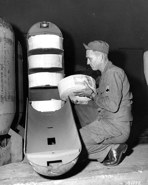 A leaflet bomb being loaded up with leaflets by a U.S. soldier. Wikipedia / Public Domain