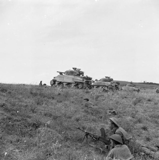The British Army in Italy 1944 Sherman tanks supporting infantry of 2/5th Leicestershire Regiment, 46th Division, near Coldazzo on the Gothic Line, 30 August 1944.