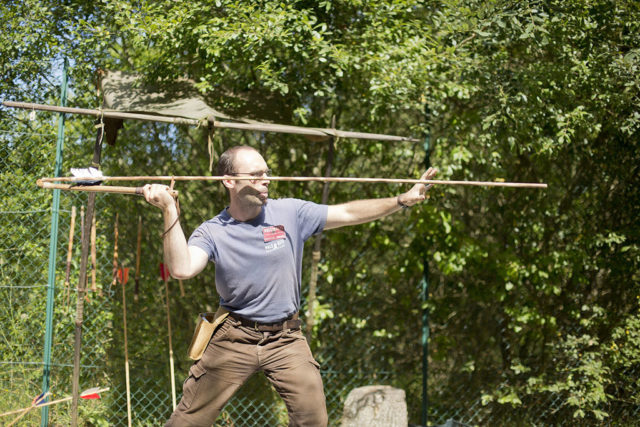 A demonstration of the atlatl, showing a proper guide hand and an extra guide for the spear. Image: Wikipedia.