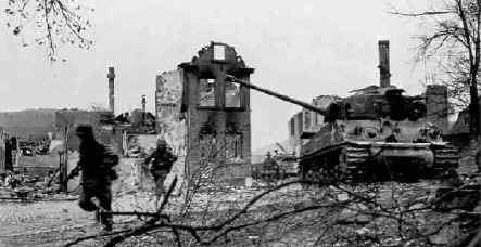 U.S. 14th Armored Division Infantry of the 19th Armored Infantry Bn. with supporting M4 medium tanks from the 47th Tank Bn. (both units of the 14th Armored Division), during the successful drive to Hammelburg, 5 April 1945, following the failed Baum Task Force of March.
