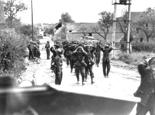 German forces surrendering in St. Lambert on 19 August 1944, By Donald I. Grant / Canada. Dept. of National Defence / Library and Archives Canada / PA-116586Original uploader was Climie.ca at en.wikipedia - Orne Departmental RecordsTransferred from en.wikipedia; transferred to Commons by User:NuclearWarfare using CommonsHelper.http://www.flickr.com/photos/photosnormandie/4438876976/in/set-72157611794620956/This image is available from Library and Archives Canada under the reproduction reference number PA-116586 and under the MIKAN ID number 3194445This tag does not indicate the copyright status of the attached work. A normal copyright tag is still required. See Commons:Licensing for more information.Library and Archives Canada does not allow free use of its copyrighted works. See Category:Images from Library and Archives Canada., Public Domain, https://commons.wikimedia.org/w/index.php?curid=6280985 