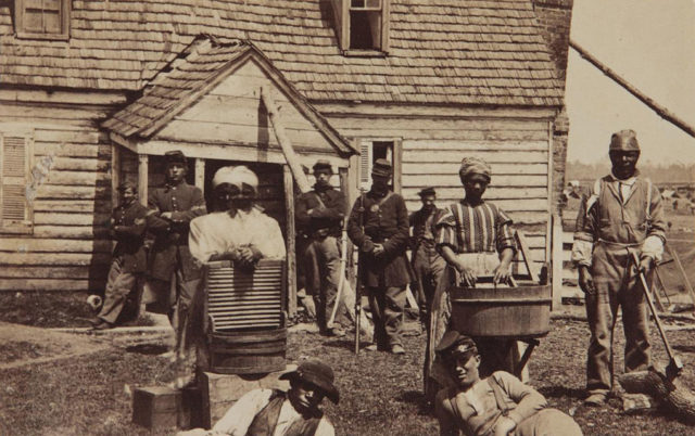 "Contraband" slaves who had fled the South working for the Union Army waiting for emancipation. After 1863, some might have been singled out for service as soldiers, scouts, or spies
