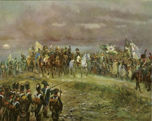 French troops present Napoleon with captured Prussian banners at the end of the battle of Jena. Source: wiki/ public domain