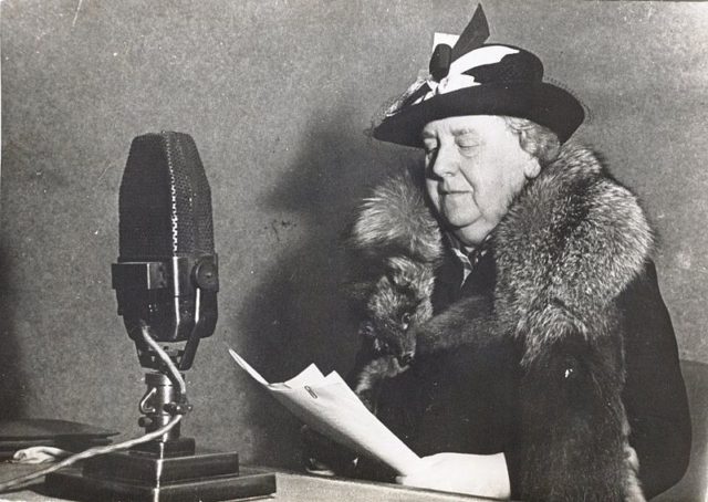 Queen Wilhelmina reading a speech on Radio Oranje to her people back home Image Source: Wikipedia