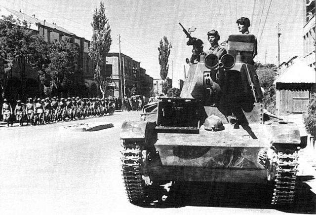 Soviet tankmen of the 6th Armoured Division drive through the streets of Tabriz on their T-26 battle tank. By Unknown - topwar.ru, Public Domain, https://commons.wikimedia.org/w/index.php?curid=22686657