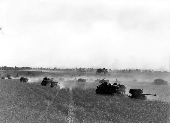 Canadian Forces move towards Falaise. By Unknown - National Archives of Canada, PA-11653, Public Domain, https://commons.wikimedia.org/w/index.php?curid=7192314
