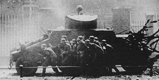 SS men attacking under cover of ADGZ vehicle. By Unknown - Apoloniusz Zawilski (1972) "Bitwy Polskiego Września" ("Battles of Polish September"), Warsaw: Nasza Księgarnia ISBN 83-218-0817-4 (current edition)Transferred from pl.wikipedia. Original upload and description by Andros64., Public Domain, https://commons.wikimedia.org/w/index.php?curid=4157242