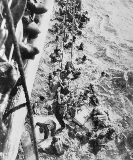 HMS Dorsetshire picking up survivors (Wikipedia / Public Domain)