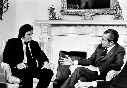 Musician Johnny Cash with President Richard Nixon, long after his military service. Ollie Atkins/Executive Office of the President of the United States/Wikipedia/Public Domain