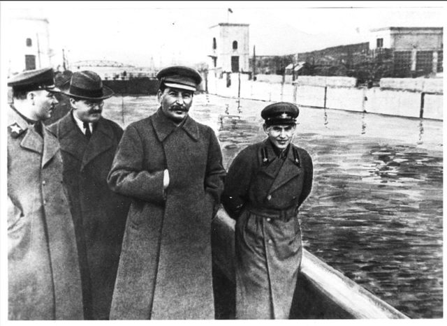 In the original version of this photo, Yezhov is clearly visible on the right of the photograph. The later version was altered by censors, removing all trace of his presence. By Unknown - http://www.tate.org.uk/tateetc/issue8/erasurerevelation.htm, Public Domain, https://commons.wikimedia.org/w/index.php?curid=4802378