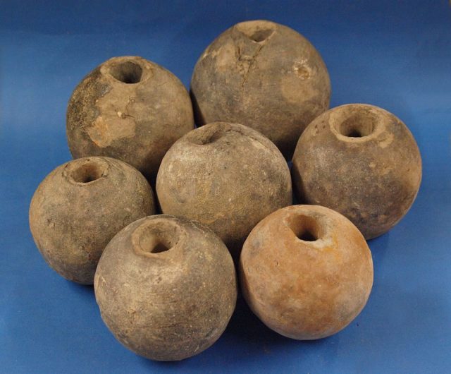 Seven ceramic hand grenades of the 17th Century found in Ingolstadt Germany. Photo Credit.