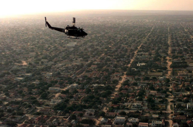 U.S. Marine Corps helicopter surveying a residential area in Mogadishu as part of Operation Restore Hope (1992)