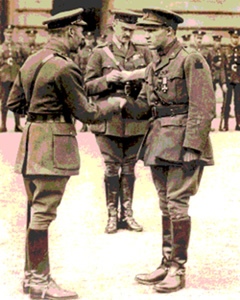 King George V (left) awarding the Victoria Cross to MacDowell at Buckingham Palace 
