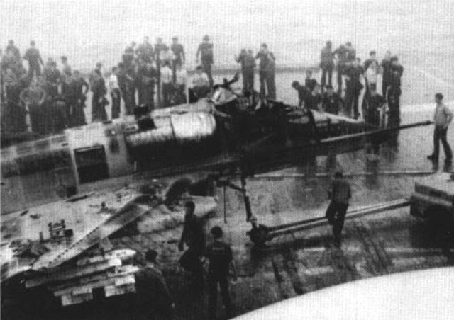 A heavily damaged Douglas A-4E Skyhawk from Attack Squadron 163 (VA-163) Saints aboard the U.S. Navy aircraft carrier USS Oriskany (CVA-34) in November 1966.