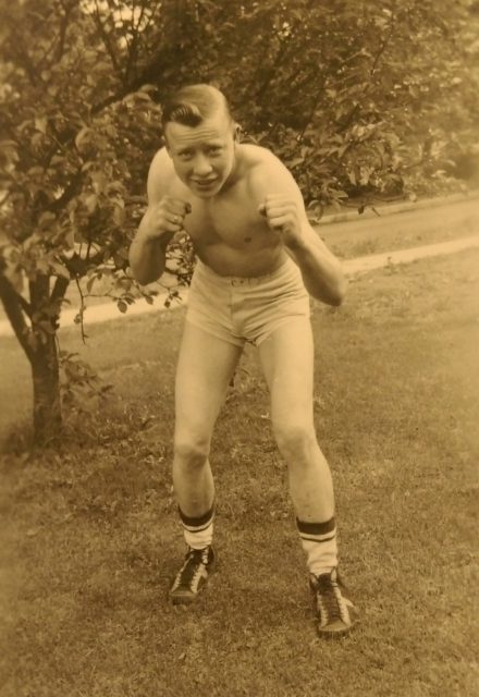 Mueller strikes a boxing pose in 1941 while participating in Golden Gloves boxing. He was drafted into the Army two years later. Courtesy of Faye Belshe.