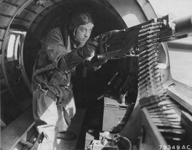 Maynard “Snuffy” Smith manning the machine gun of a B-17.