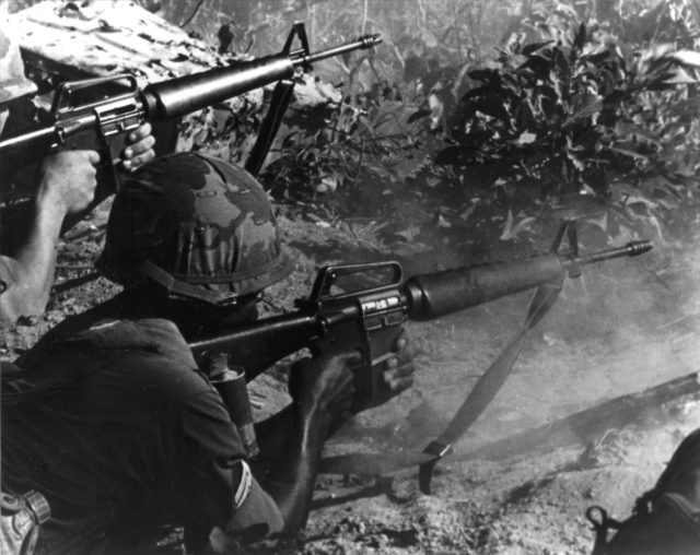 American_sergeant_&_rifleman_engage_enemy_with_M16s_in_Vietnam