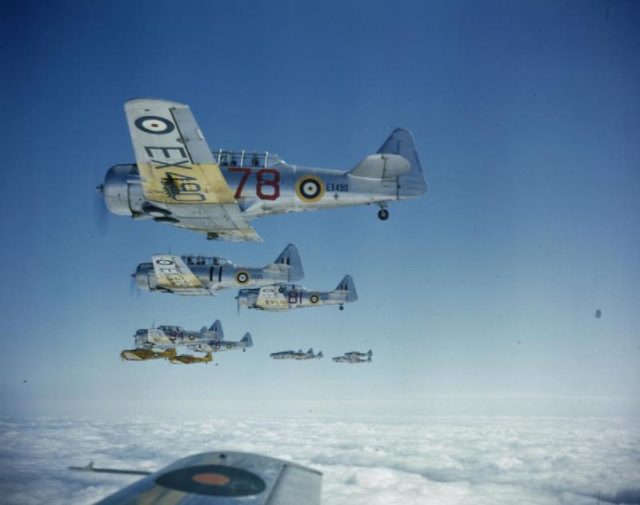 A flight of North American Harvard IIAs from No 20 Service Flying Training School being flown in formation by RAF trainee pilots participating in the Commonwealth Joint Air Training Programme