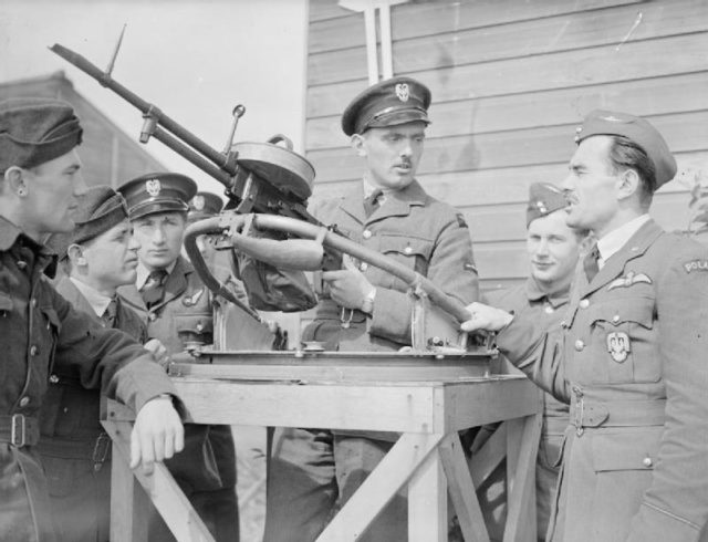 Trainee Polish air gunners receive instruction on a Vickers (VGO) K machine gun at a bombing and gunnery school. These were some of the Polish airmen who had escaped to Britain after the Battle of France, some of whom had been serving with the French Air Force.