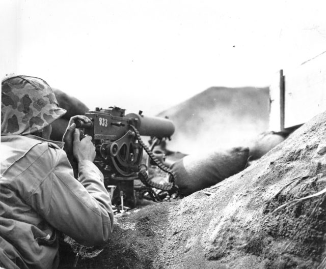 A photo of a Marine machine gunner during WWII. Photo Credit