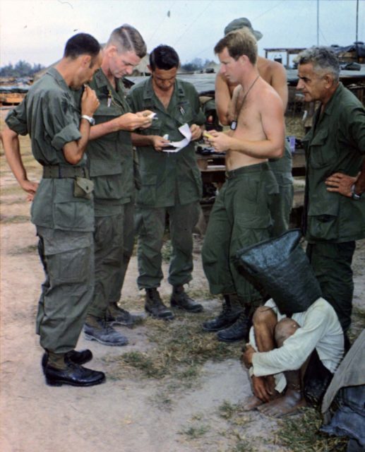 American soldiers with an alleged Viet Cong captive near the Cambodian border.