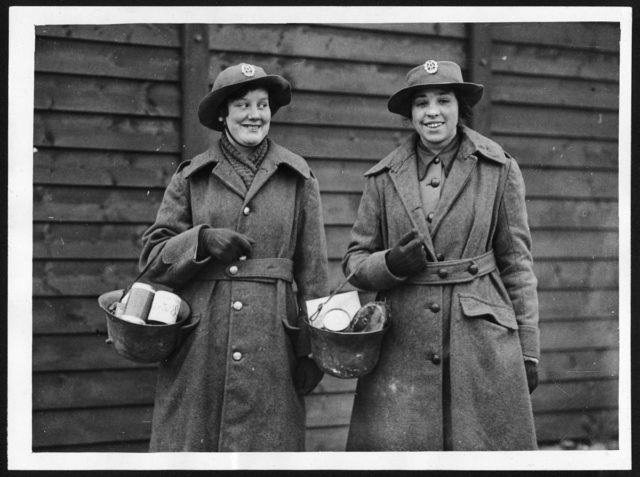 WAAC’s in France find German helmets useful substitutes for market bags.