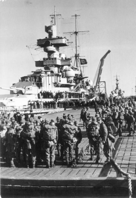 The Admiral Hipper loading troops in Cuxhaven;
