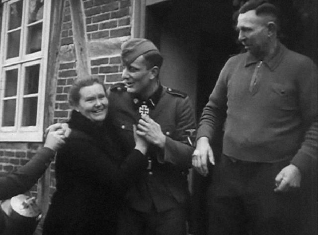 Kristen celebrating with his parents after receiving the Iron Cross