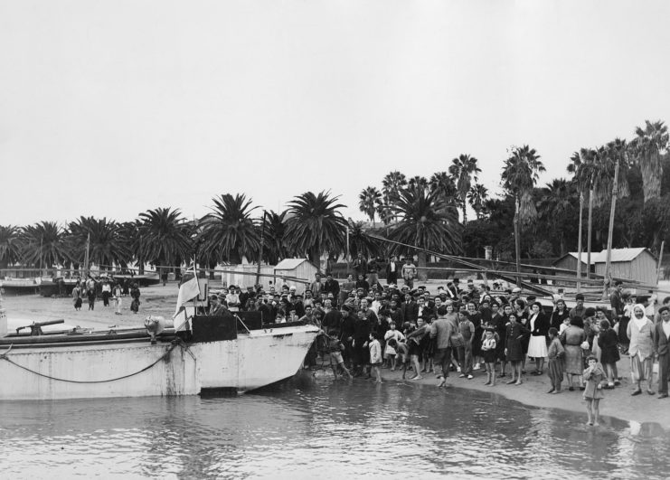 Locals greet US Troops on the shore