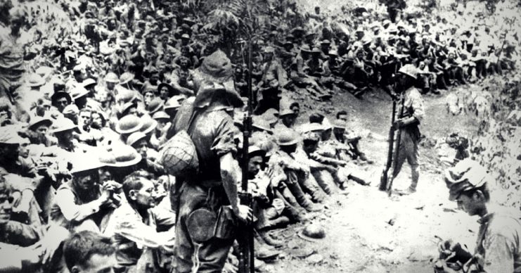 American soldiers resting during the Bataan death march, May 1942.