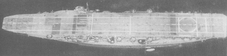 Kaga after reconstruction showing the new, full-length flight deck above the wide battleship hull.