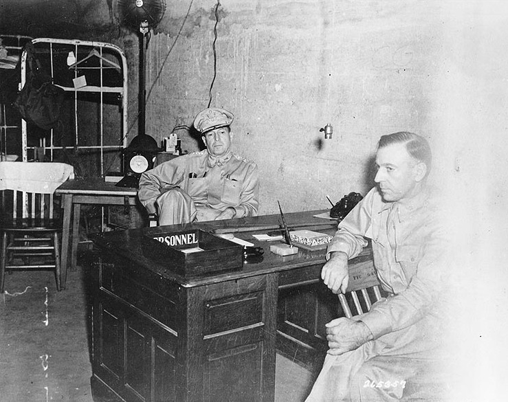 General MacArthur (seated, center) with his chief of staff on Corregidor, 1942.