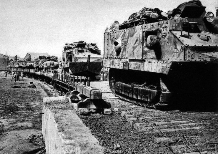 Schneider tanks, here with the later cross-hatched camouflage, were mostly transported by rail.