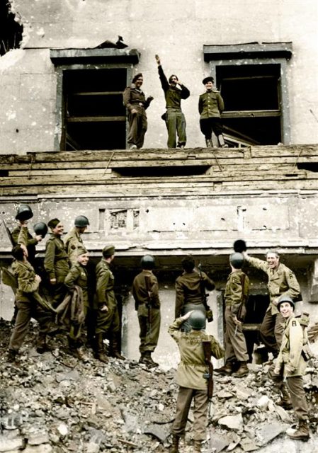 July 06, 1945 – The final victory over Nazi Germany achieved, soldiers and allies of the British, American and Russian armies mimic and mock Adolf Hitler and his ideas on Hitler’s famous balcony at the Chancellery in conquered Berlin. Paul Reynolds / mediadrumworld.com
