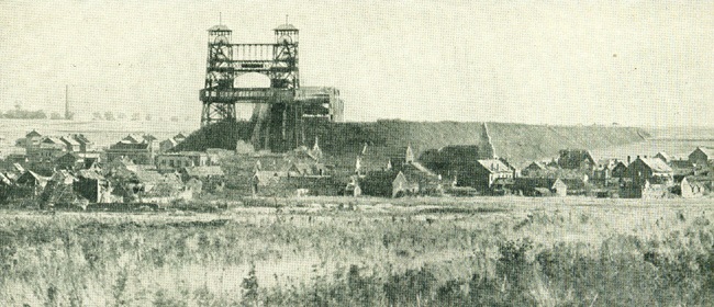 The town of Loos and mine head winding gear showing extensive slag heaps.