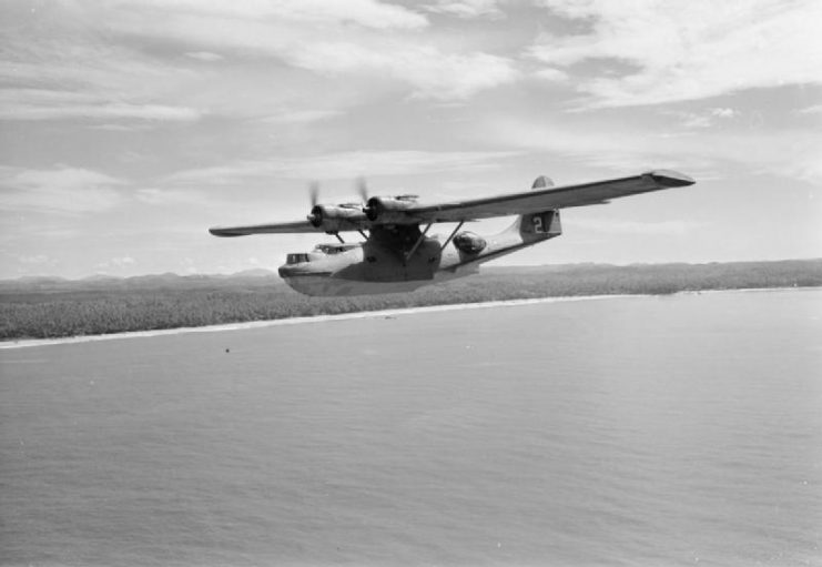 American Catalina Mark IB FP244/G-AGFM 2 “Altair Star”, operated by QANTAS, flying along the coast of Ceylon at the conclusion of a long-haul flight from Australia.