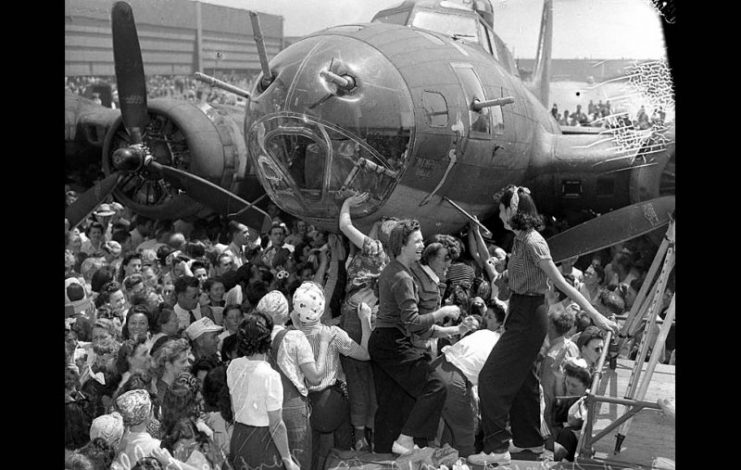 Aug. 18, 1943: Women aircraft workers sign their names on the B-17 bomber Memphis Belle during a visit in Long Beach.