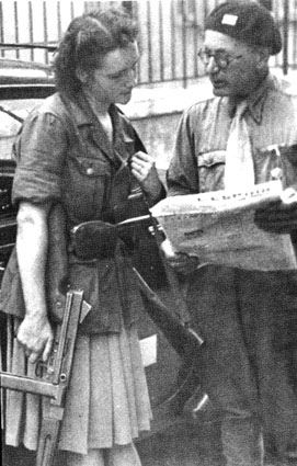 French Resistance Members – Woman carries a Thompson sub-machine gun and wears a German jacket.