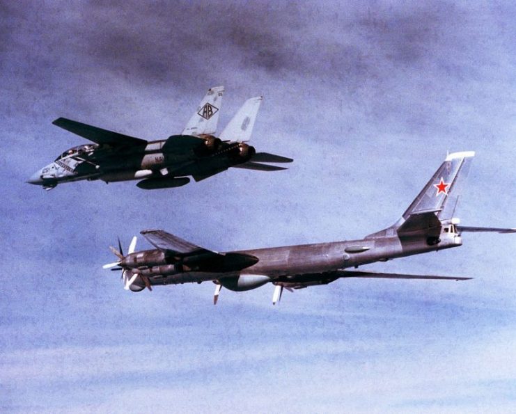 A U.S. Navy Grumman F-14A Tomcat fighter (BuNo 159452) squadron VF-102 Diamondbacks escorts a Soviet Tu-95RTs Bear-D surveillance aircraft over the North Atlantic, on 1 September 1985. VF-102 was assigned to Carrier Air Wing 1 (CVW-1) aboard the aircraft USS America (CV-66) for a deployment to the Atlantic Ocean from 24 August to 9 October 1985.