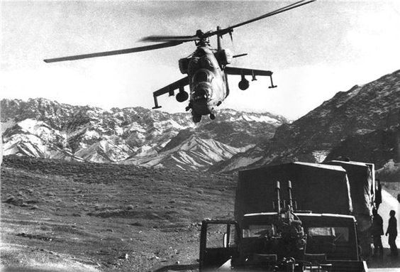 Mi-24 Flying over Soviet Soldiers in Afghanistan